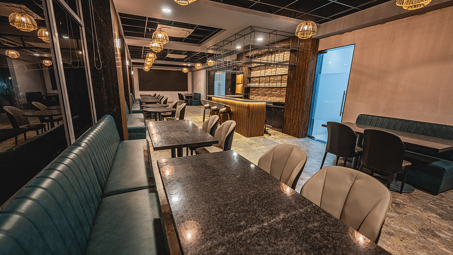 A stylish dining area with elegant booths and ambient lighting at Lotus Leaf Boutique Hotel.