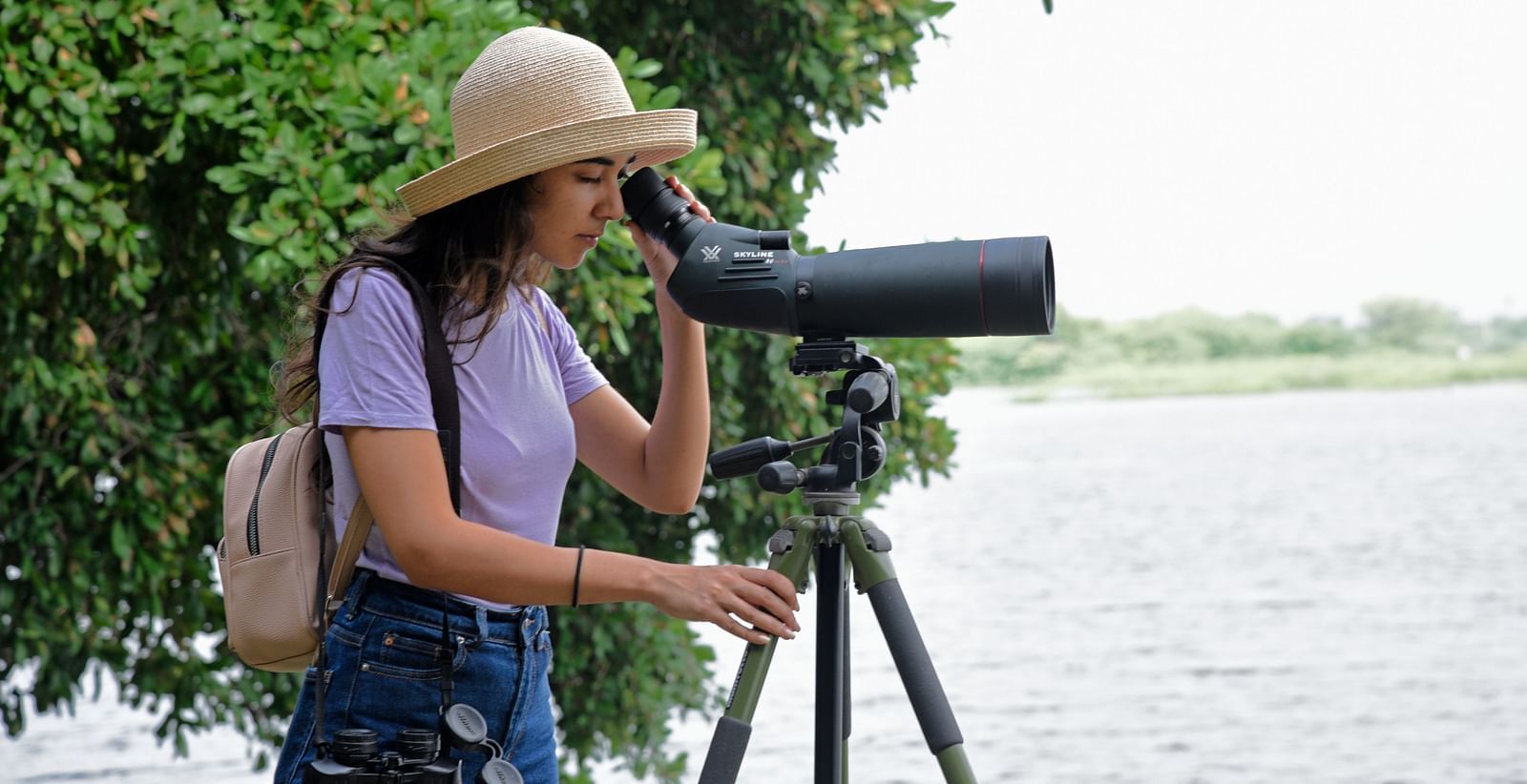 An image of a girl lookig through a telescope- Shahpura Bagh.