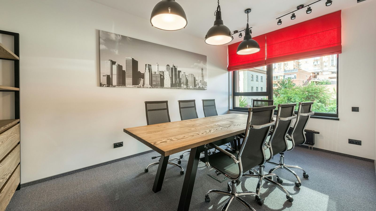 Modern boardroom with a conference table and chairs designed for business meetings and presentations.
