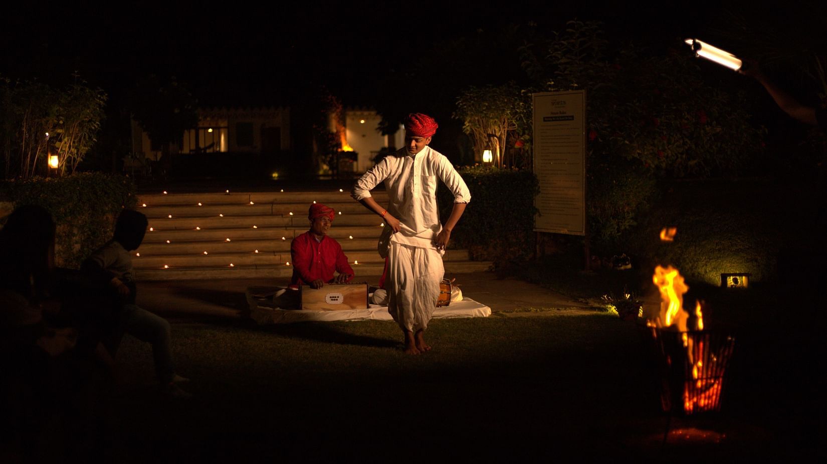 A man sings Rajasthani folk music while another man dances to it - The Baagh Ananta Elite Ranthambore