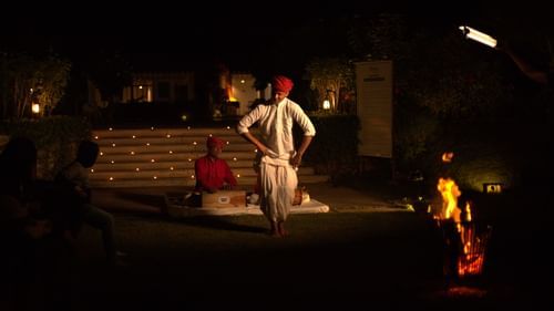 A man singing Rajasthani folk music while another man dances to it - The Baagh Ananta Elite, Ranthambore