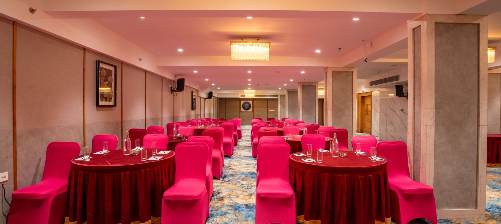 Banquet setup with cluster seating and round tables at Hotel Royal Regency Chennai