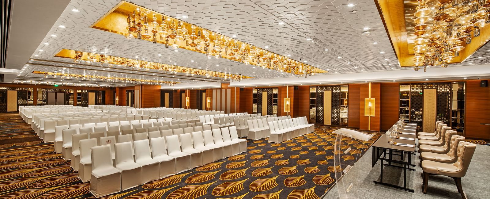 Conference hall with white seating and a modern design, ready for an event at Radisson BLU