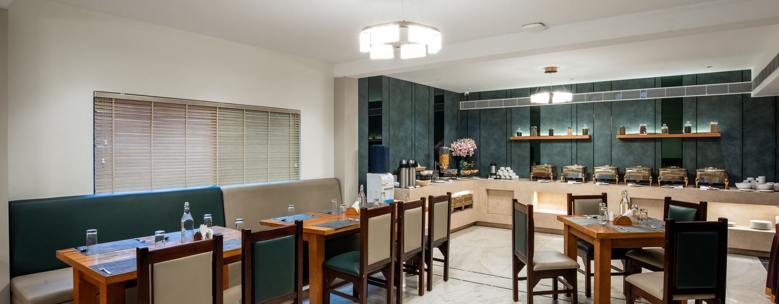 Casual dining area with modern decor and seating at Hotel Royal Regency Chennai