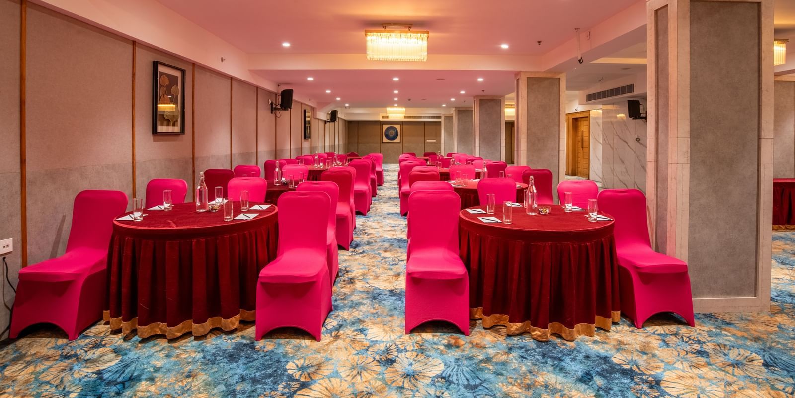 Banquet setup with cluster seating and round tables at Hotel Royal Regency Chennai