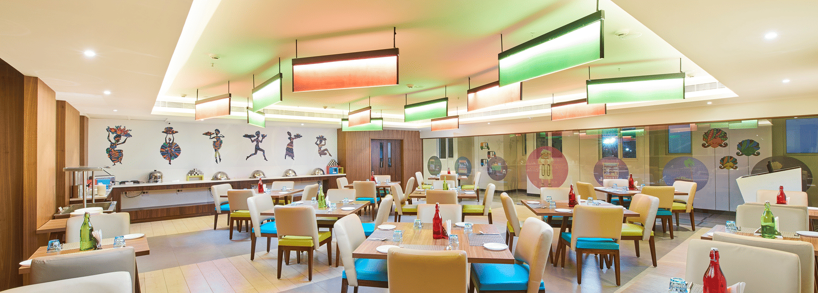 an image of a restaurant with illuminating modern lights  at Zibe Salem by GRT Hotels
