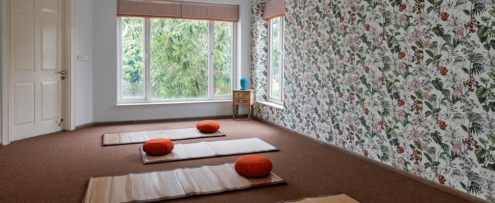An image of a room with multiple mats on the floor.