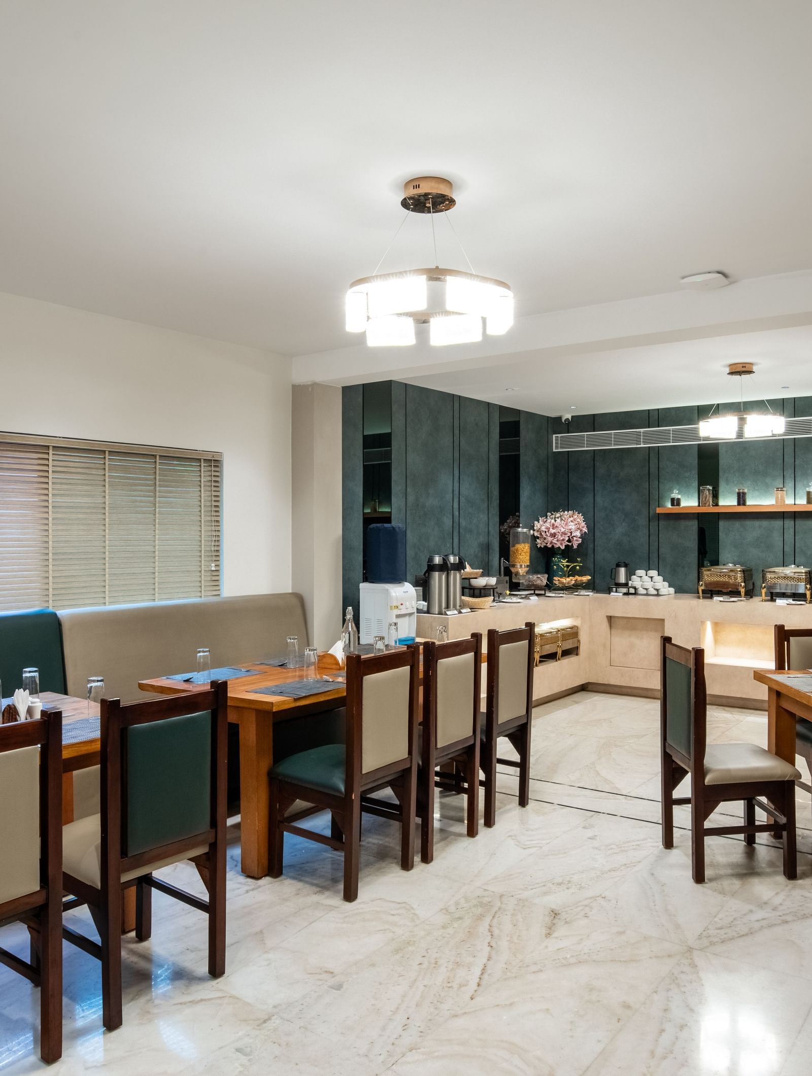 Casual dining area with modern decor and seating at Hotel Royal Regency Chennai