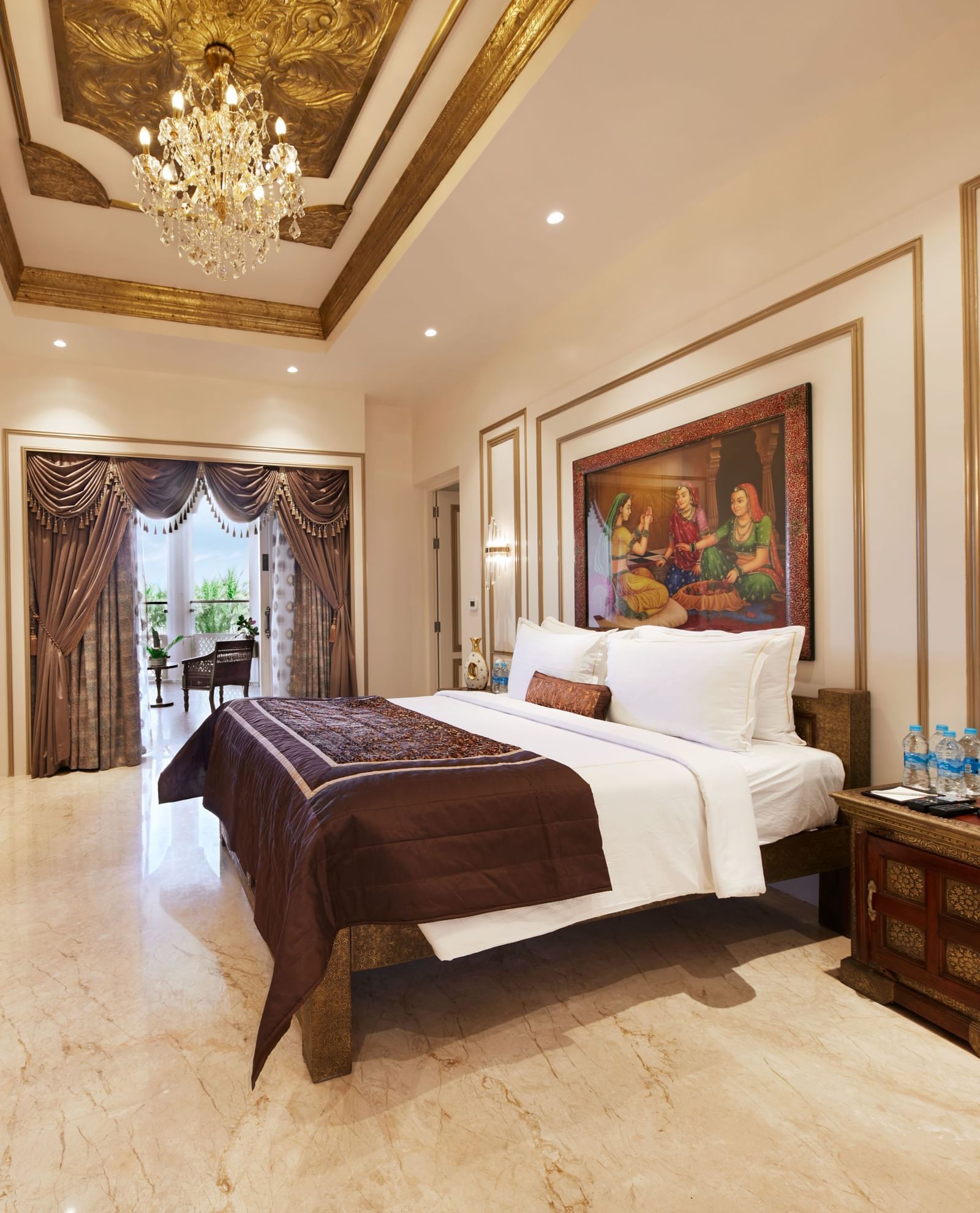 A charming bedroom with a royal bed frame and warm golden lighting – Kaldan Samudra, one of the finest beach resorts in ECR