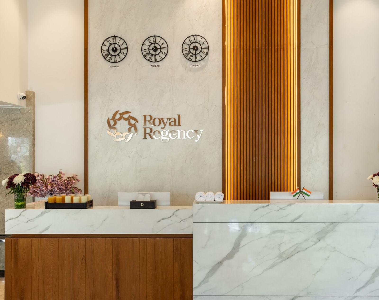 Reception desk with Royal Regency branding and decor at Hotel Royal Regency Chennai