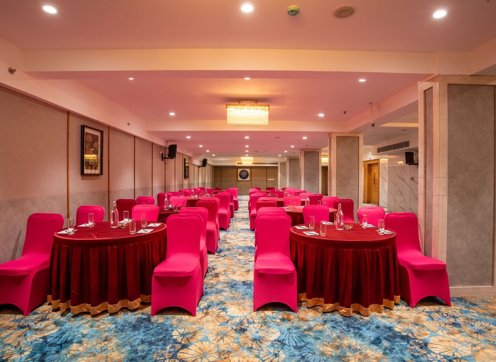 Banquet setup with cluster seating and round tables at Hotel Royal Regency Chennai