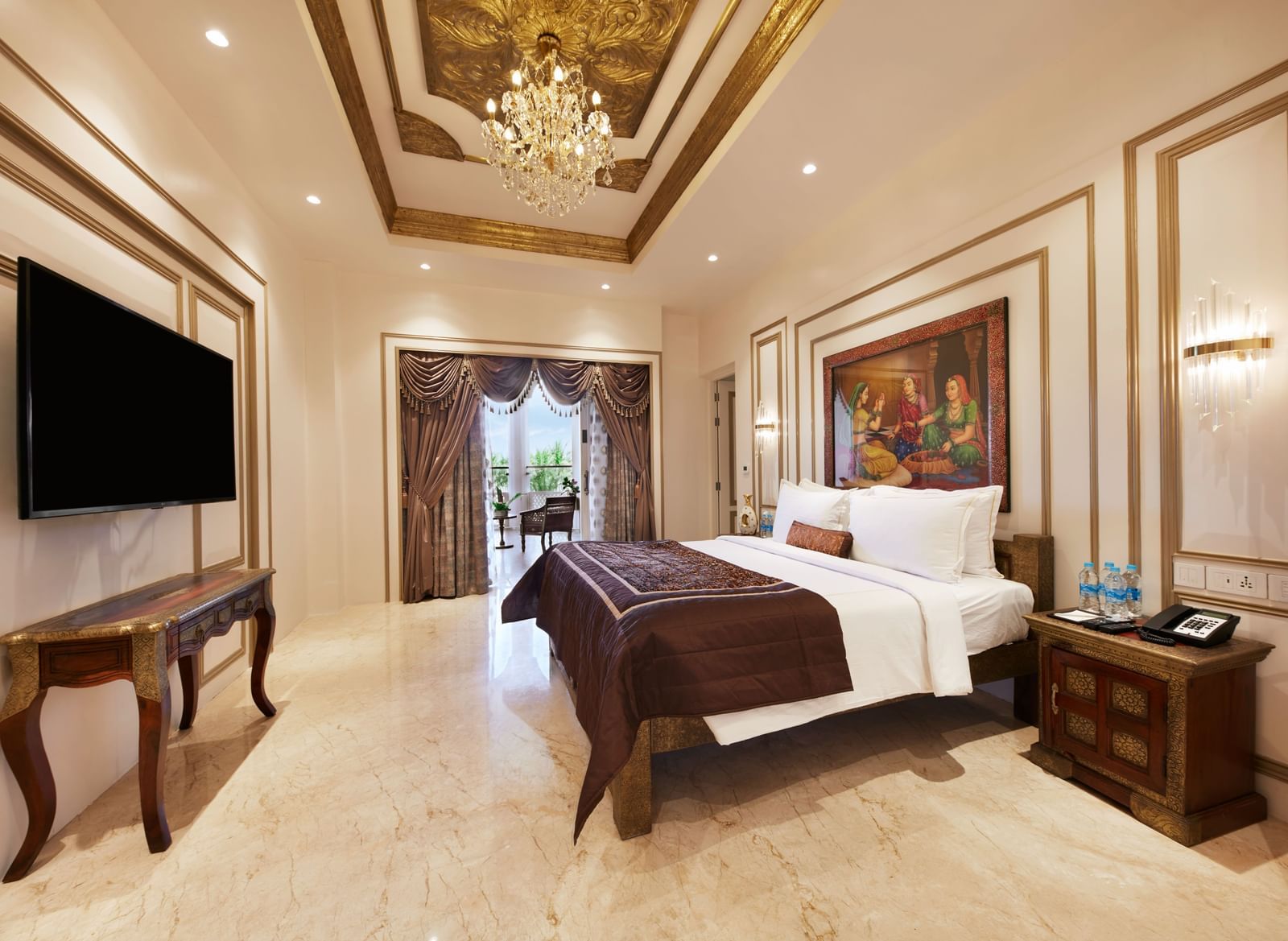 A charming bedroom with a royal bed frame and warm golden lighting – Kaldan Samudra, one of the finest beach resorts in ECR