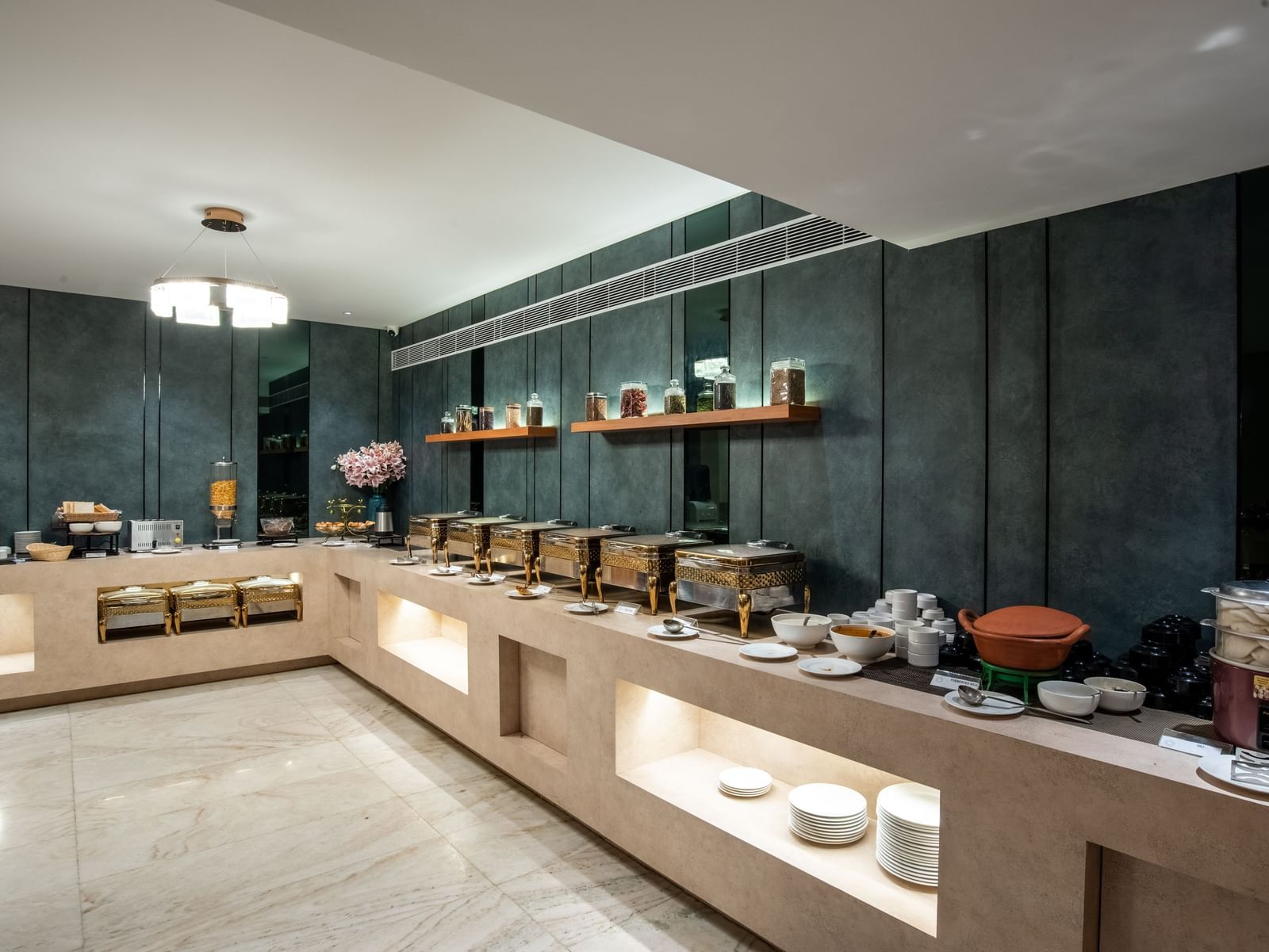 Buffet counter with a wide variety of dishes at Hotel Royal Regency Chennai