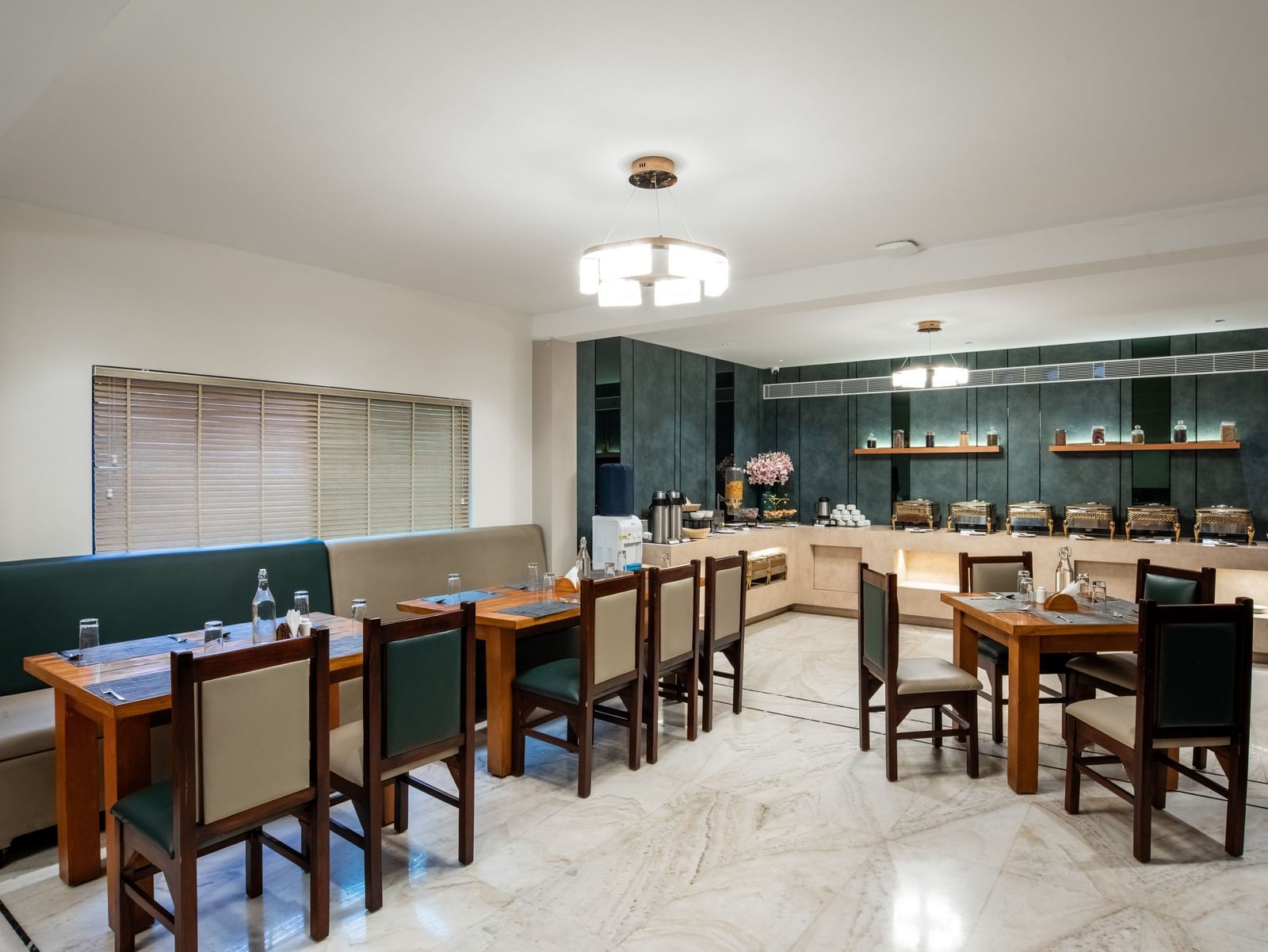 Casual dining area with modern decor and seating at Hotel Royal Regency Chennai