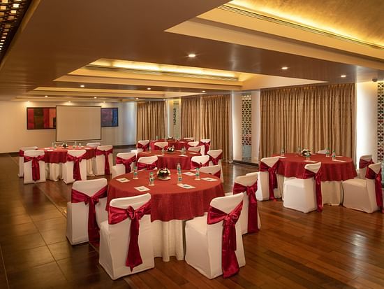 hall with seats draped with white and red cloth