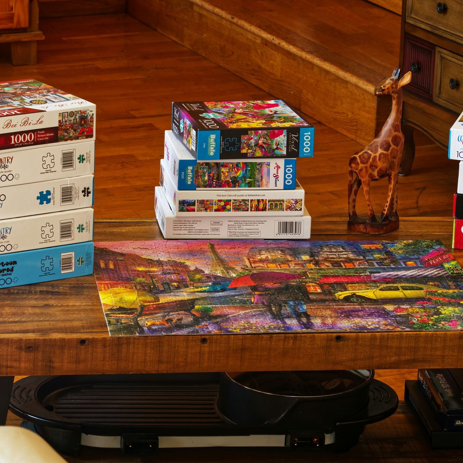 Game boxes on the table and a solved puzzle