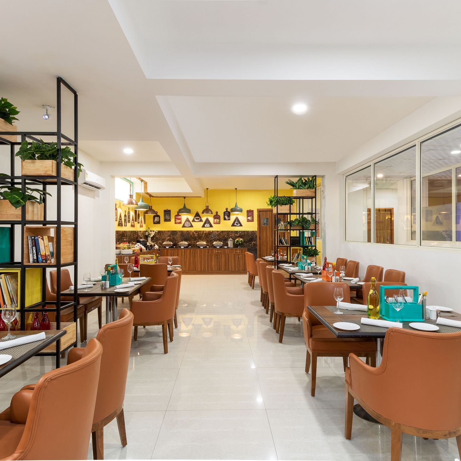 Cafe Inde seating area with chic ambience and brown chairs | Inde Hotel Cyber City