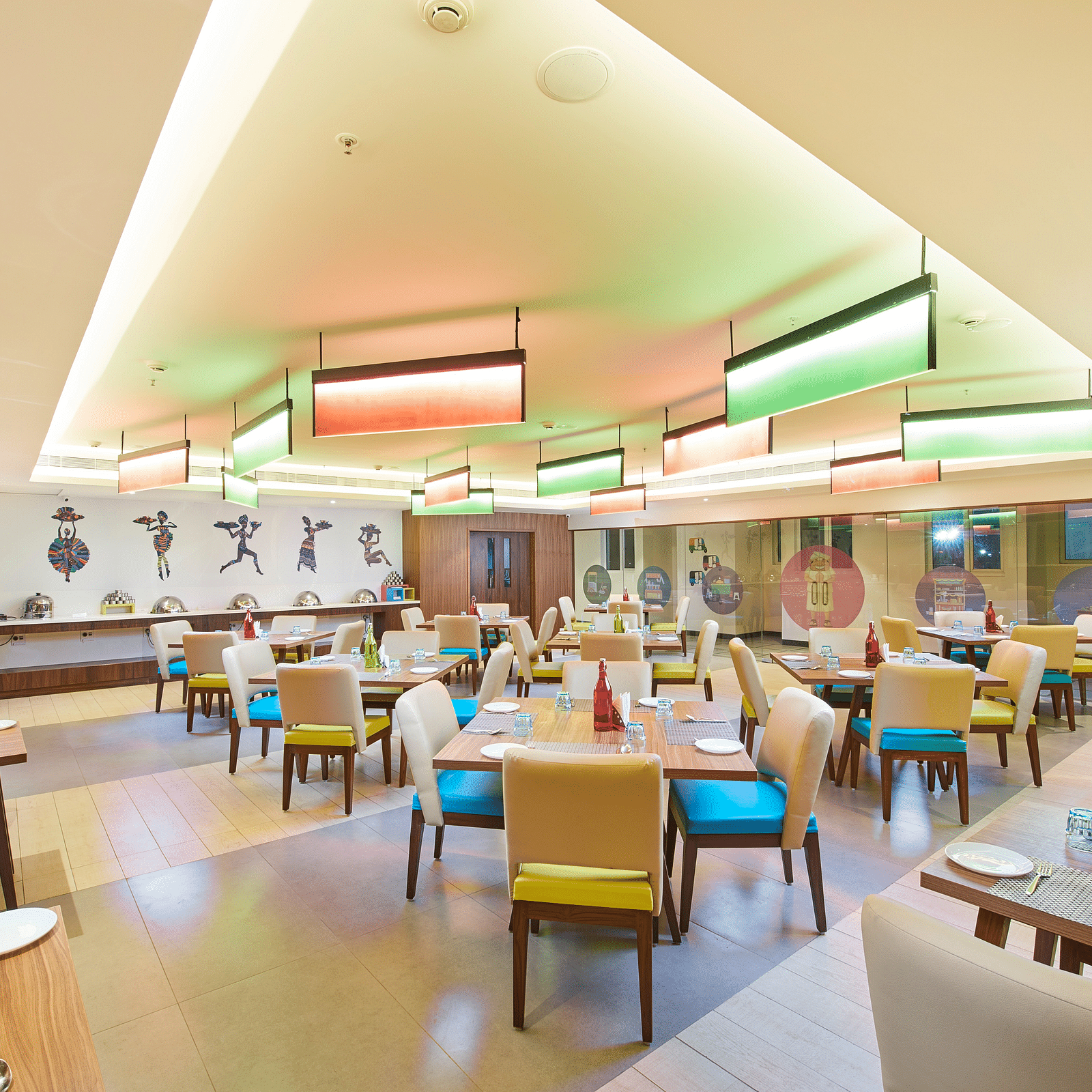 an image of a restaurant with illuminating modern lights  at Zibe Salem by GRT Hotels