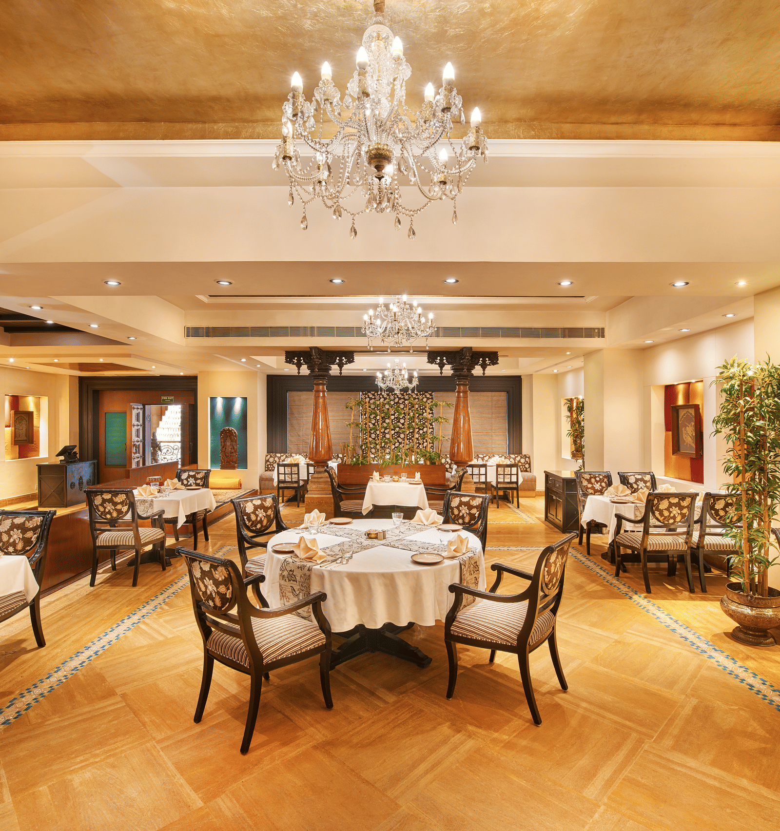 An image of a dining area with several sets of table and chairs at Accord Hotels and Resorts