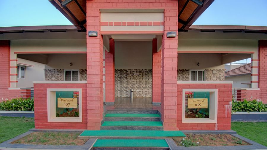 An up-close view of the building structure at Woodstock Resorts, Coorg emphasising the architectural details.