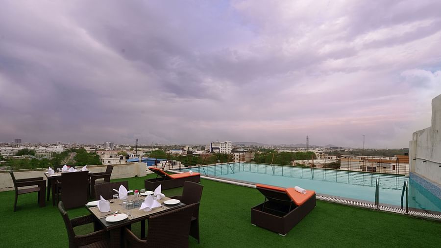 Rooftop Swimming pool with lounge chairs and a seating arrangement