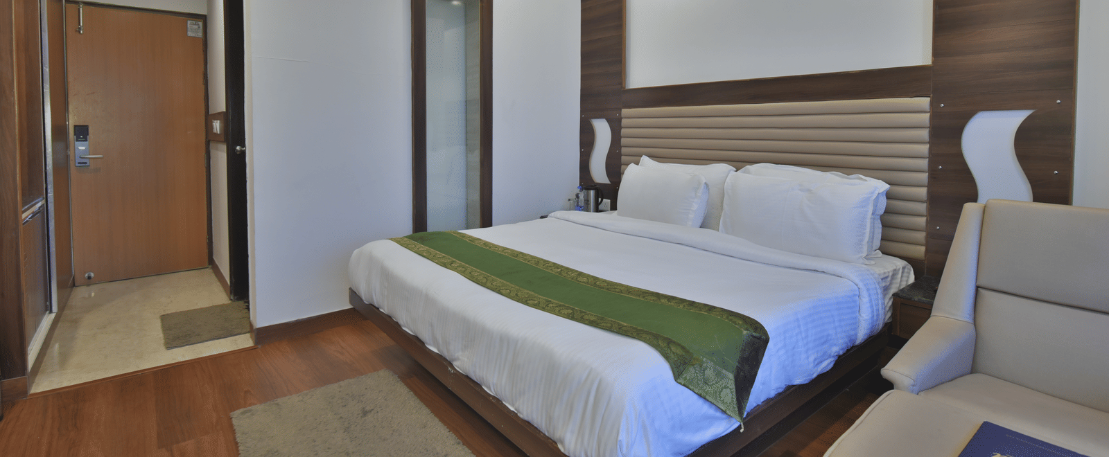 A view of the large bed in the Premium Room at DLS Highland Resort and Spa, Mussoorie.