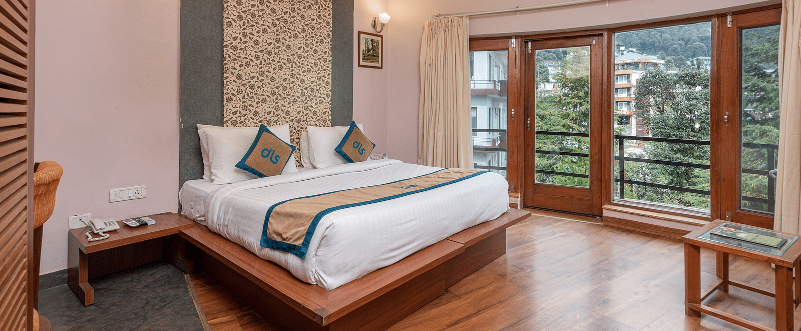 A Luxury Cottage at DLS Spring Valley Resort Dharamshala featuring a king size bed, table and a big balcony