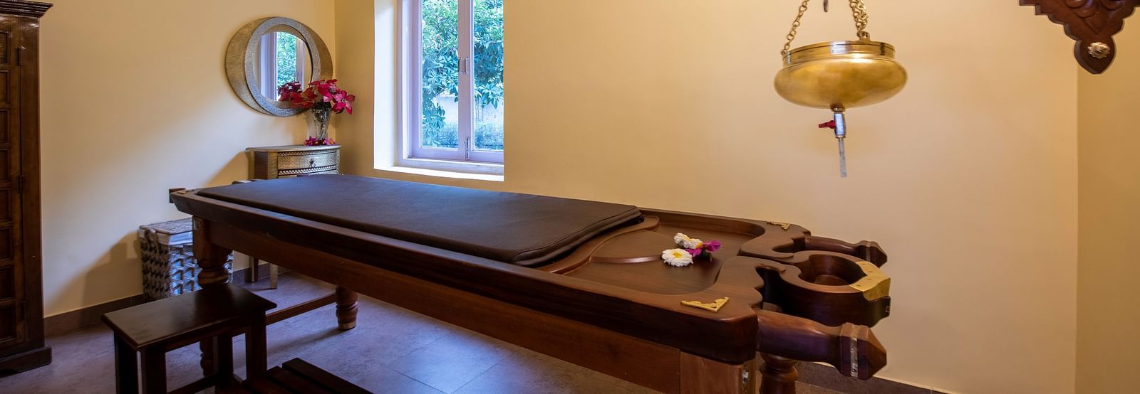 An image of a room with ayurvedic treatment in a spa at BluSalzz Resort.