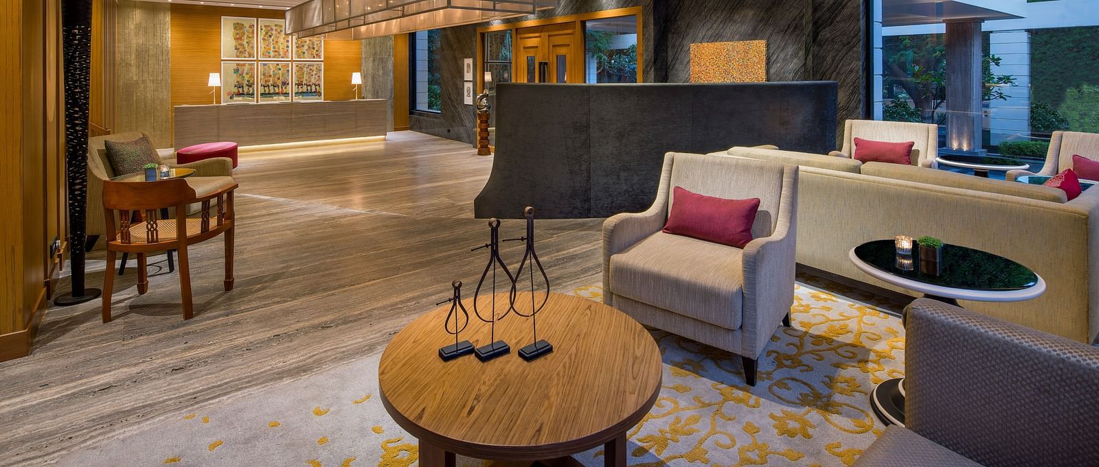 Image of a Lobby sitting area at The Raintree St. Mary s Road with high ceiling and chic decor