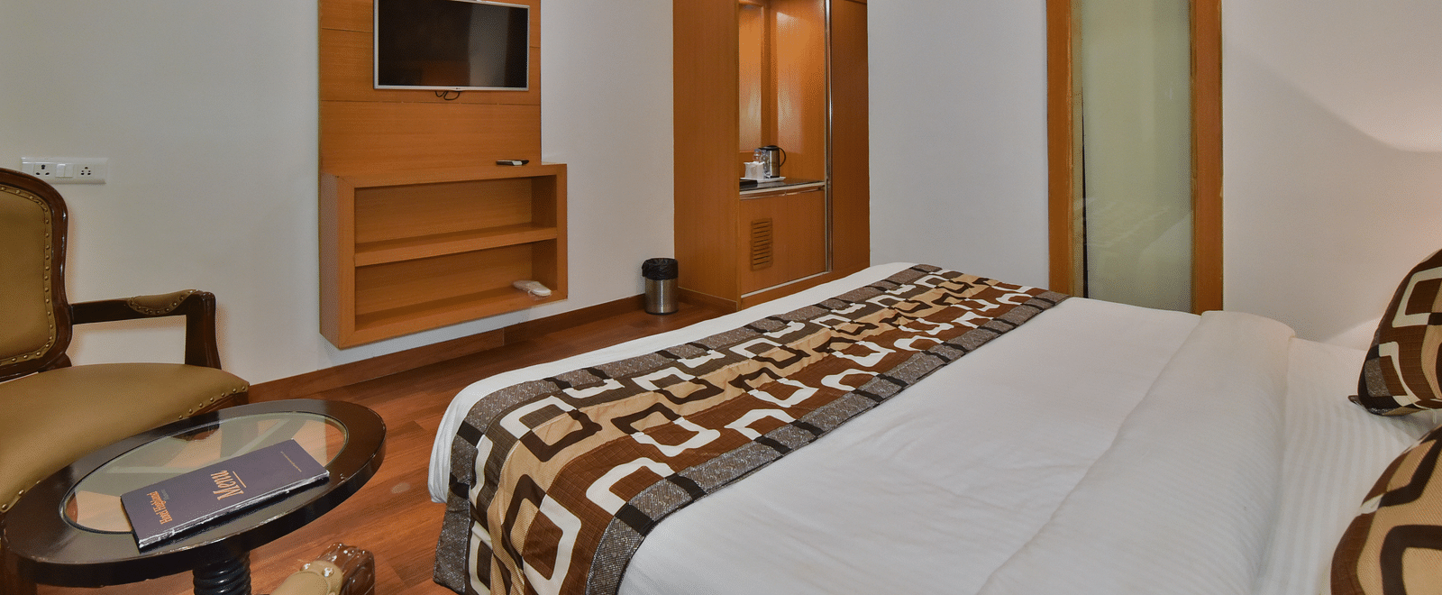 View from the bed of the TV in Deluxe Room at DLS Highland Resort and Spa, Mussoorie.