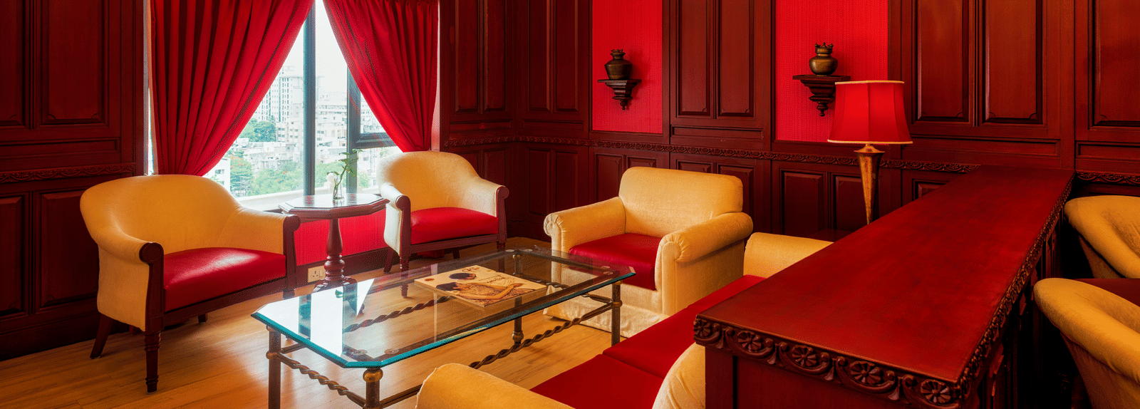  Room with sofas and tables at Grand Chennai By GRT Hotels.