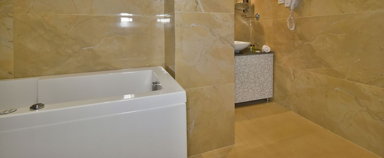 Luxury Room Washroom at DLS Dalhousie Valley Resort featuring a Jacuzzi and sink area.