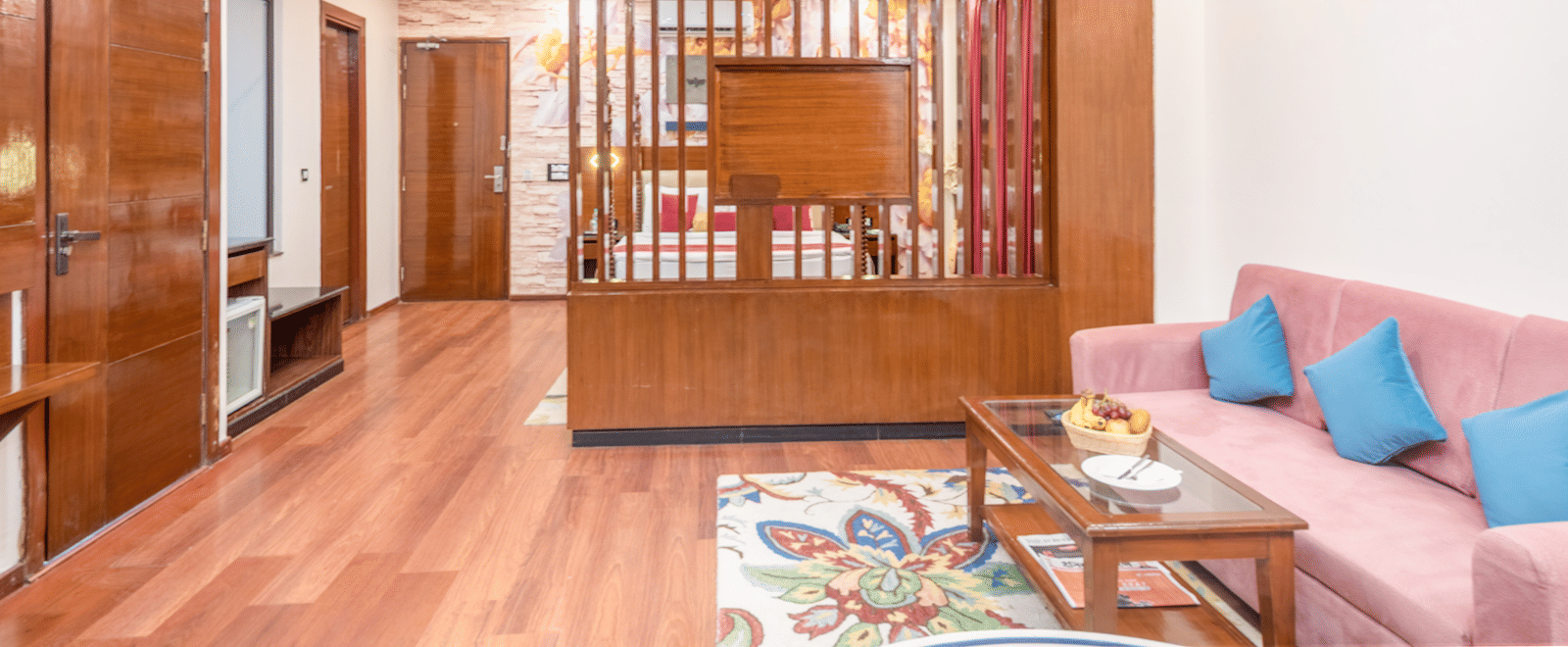 Living area with sofa and partition at DLS Hotels On The Ganges.