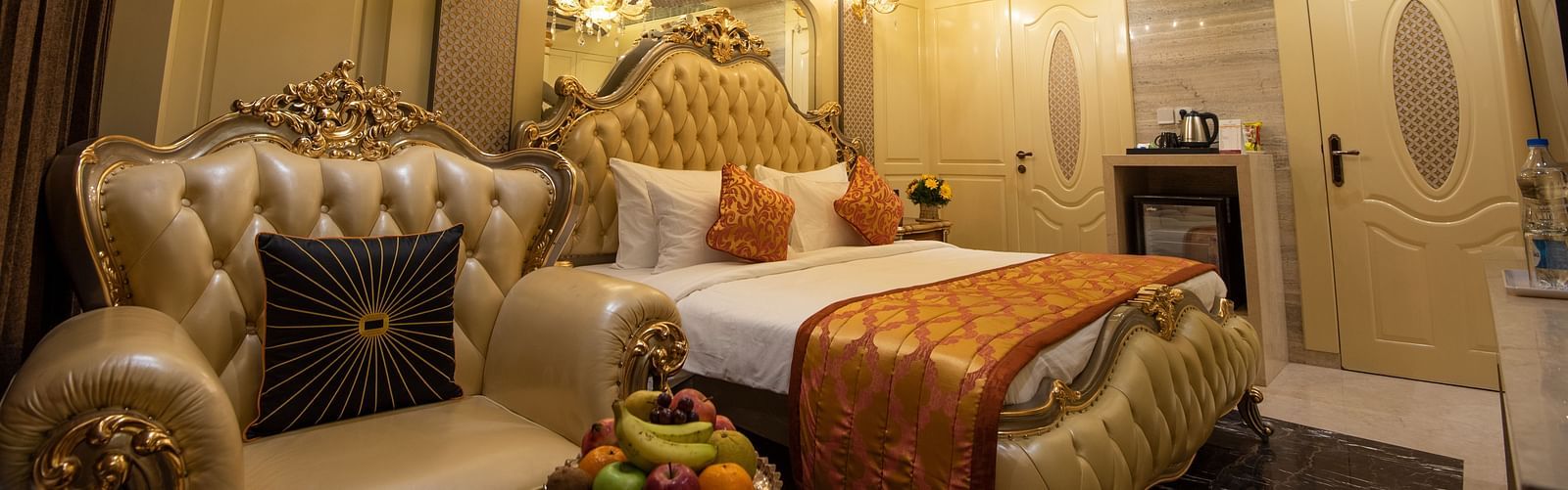 a view of King Suite featuring a bed under a chandelier at Hotel Park Elanza, Coimbatore