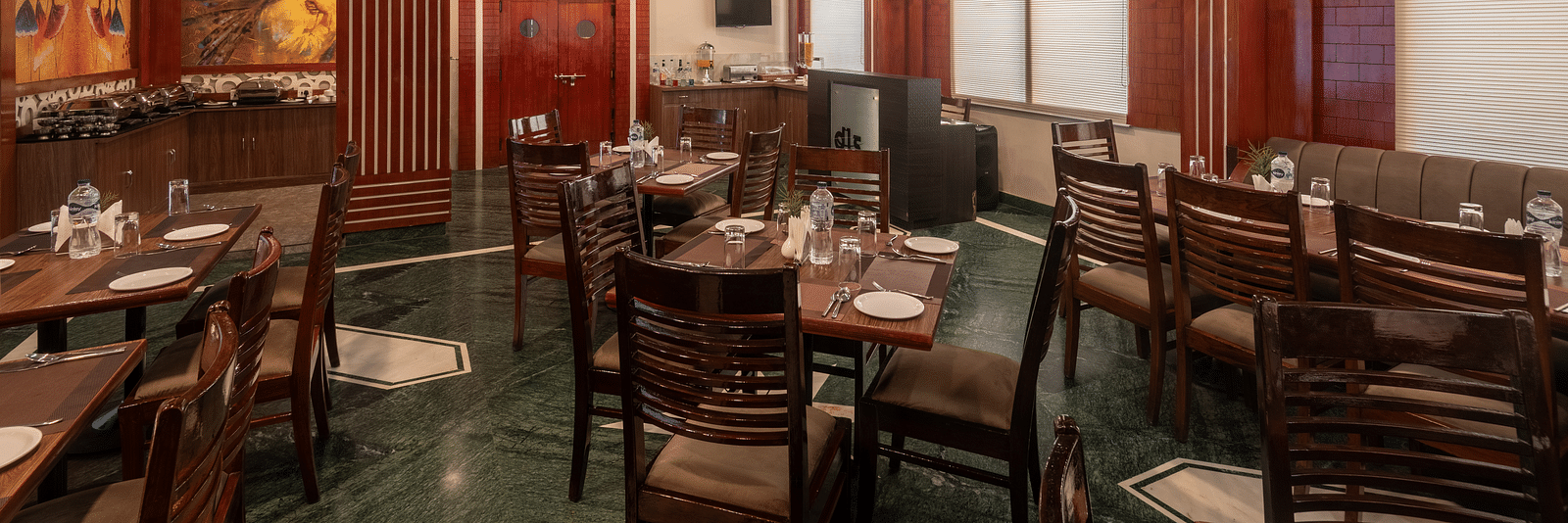 Dining area with chairs and tables at DLS Park Grace, Haridwar.