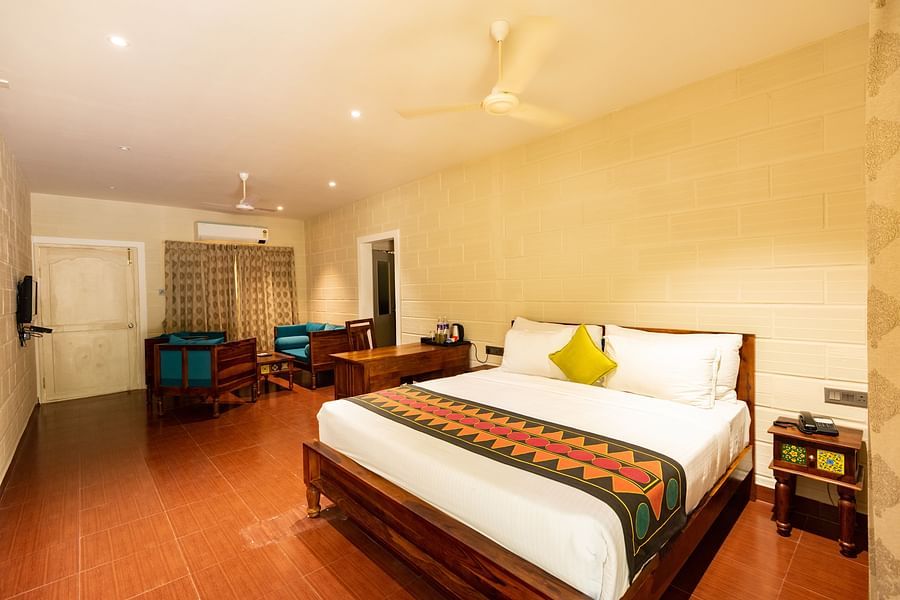 an overview of the Suite with a double bed at Ibex River Resort, Pollachi