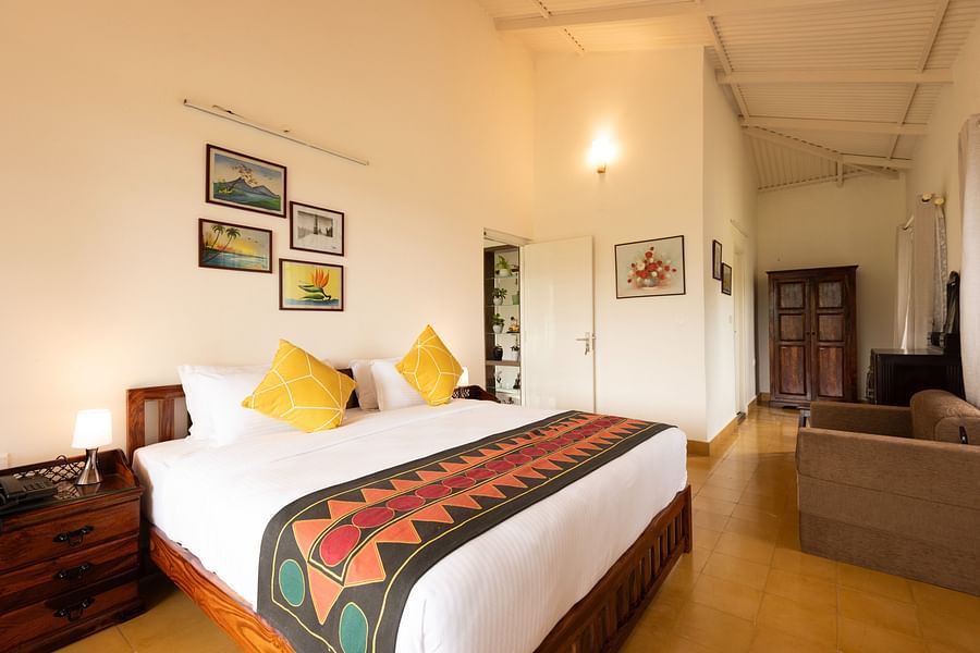 Main House Bedroom II with a king bed and side table - Ibex Stays & Trails, Kotagiri