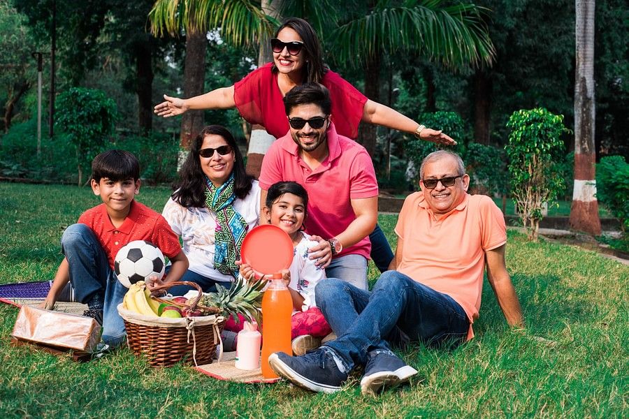 alt-text a family posing for the camera at a picnic 2