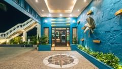 the entrance to the reception with blue coloured walls - polo floatel kolkata