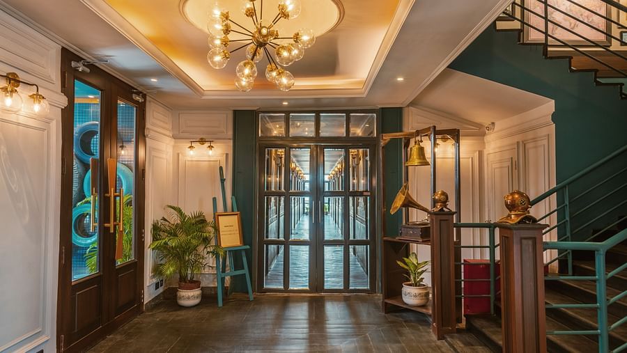 the corridor with stairs on the right side - polo floatel kolkata