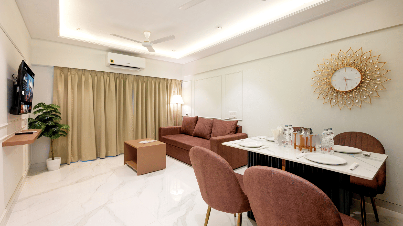 Open plan living and dining area in a serviced apartment at Home2 Residency, Mumbai Airport