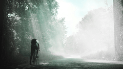 A person cycling in the woods