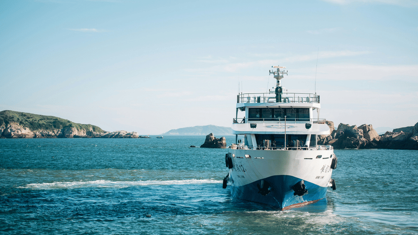 A view of the ferry travelling on a waterbody with people on it - Port Blair to Havelock Island Distance by Ferry.