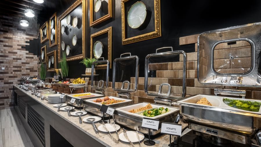 Chafing dishes with salads and hot food items as part of the buffet at Best Western Premier Westlands.