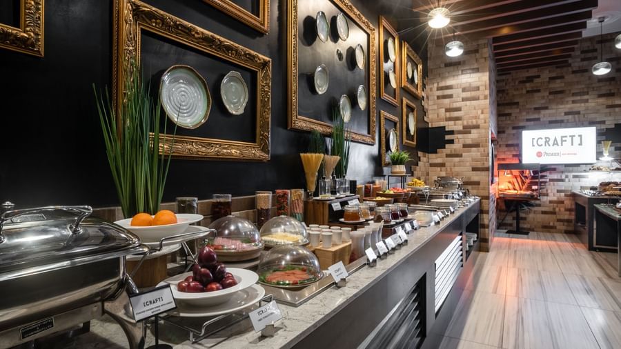 Buffet display with various dishes in CRAFT restaurant at Best Western Premier Westlands.