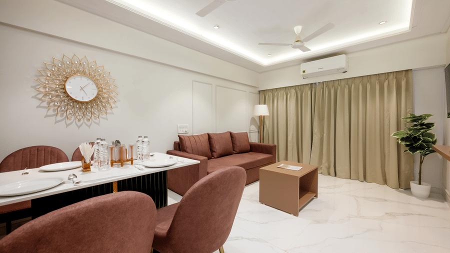 Open plan living and dining area in a serviced apartment at Home2 Residency, Mumbai Airport