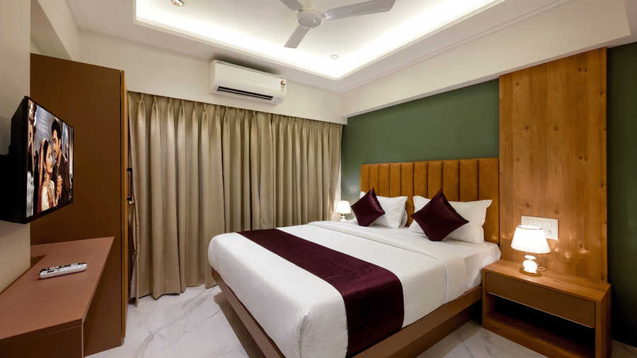 Elegant king bedroom with contemporary interiors at Home2 Residency, Mumbai Airport