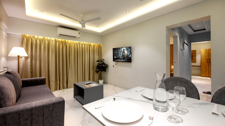 Open plan living area in a serviced apartment at Home2 Residency, Mumbai Airport