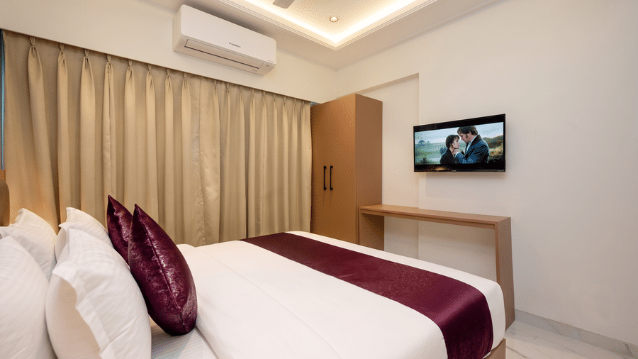 Comfortable king bedroom with television at Home2 Residency, Mumbai Airport