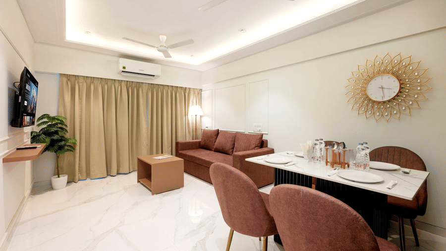 Open plan living and dining area in a serviced apartment at Home2 Residency, Mumbai Airport